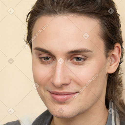 Joyful white young-adult male with medium  brown hair and brown eyes