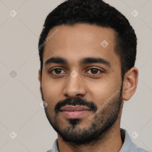 Neutral black young-adult male with short  black hair and brown eyes