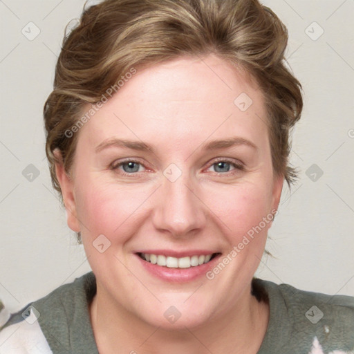 Joyful white young-adult female with medium  brown hair and blue eyes