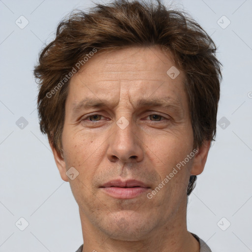 Joyful white adult male with short  brown hair and grey eyes