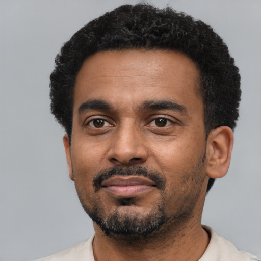 Neutral black young-adult male with short  black hair and brown eyes