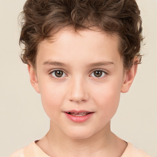 Joyful white child male with short  brown hair and brown eyes