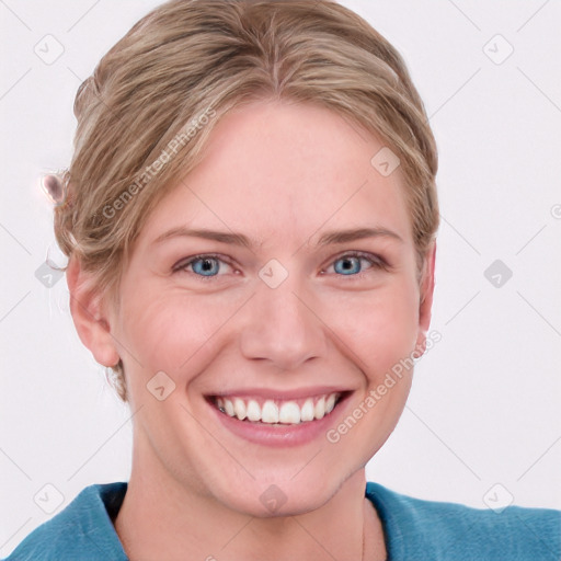 Joyful white young-adult female with short  brown hair and blue eyes