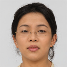 Neutral asian young-adult female with short  brown hair and brown eyes