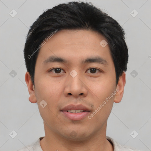 Joyful asian young-adult male with short  brown hair and brown eyes