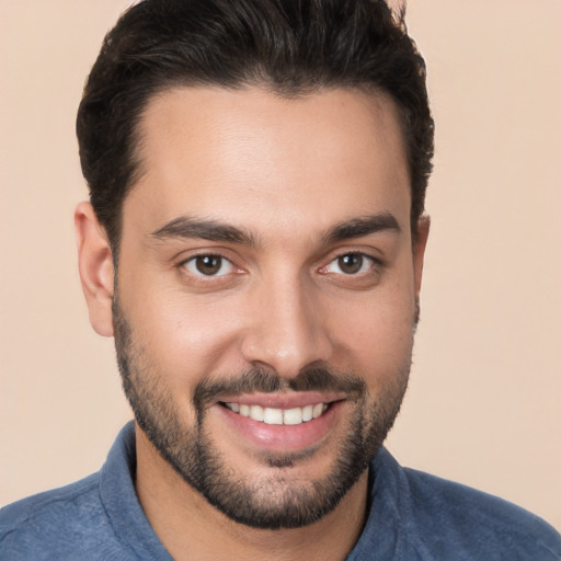 Joyful white young-adult male with short  brown hair and brown eyes