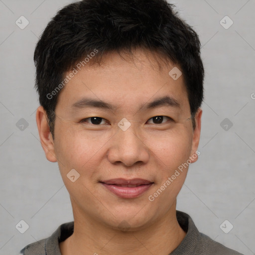 Joyful asian young-adult male with short  brown hair and brown eyes