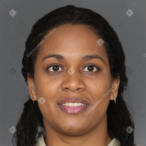 Joyful black young-adult female with long  brown hair and brown eyes