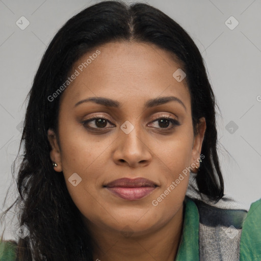 Joyful black young-adult female with long  brown hair and brown eyes