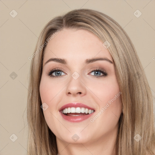 Joyful white young-adult female with long  brown hair and blue eyes