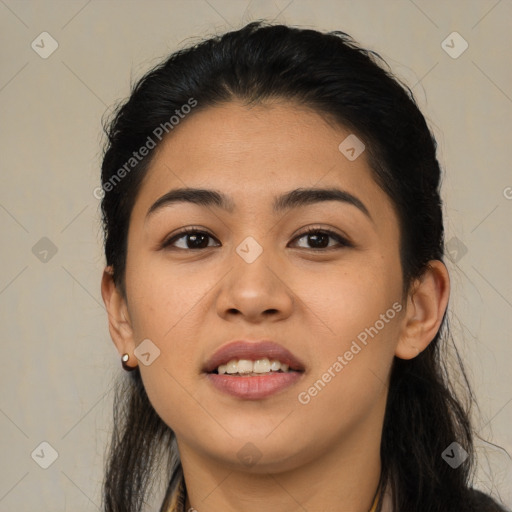 Joyful latino young-adult female with long  black hair and brown eyes