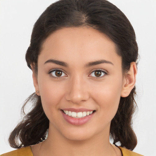 Joyful white young-adult female with medium  brown hair and brown eyes