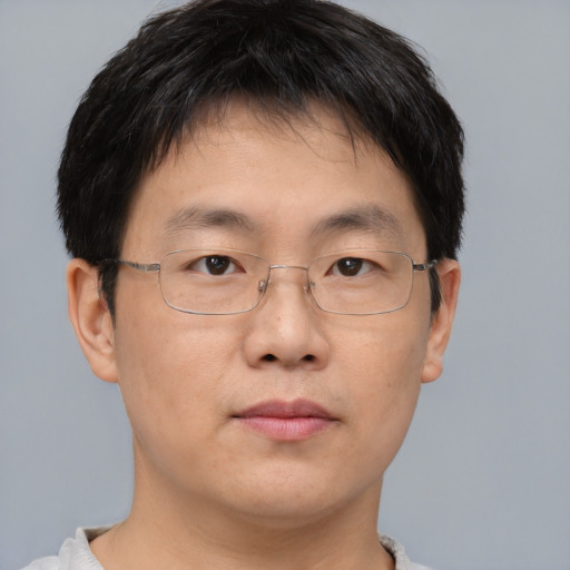 Neutral asian adult male with short  brown hair and brown eyes
