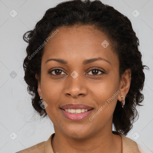 Joyful black adult female with short  brown hair and brown eyes