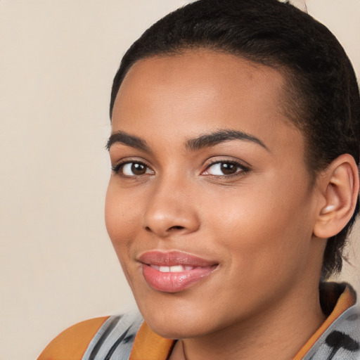 Joyful white young-adult female with medium  black hair and brown eyes