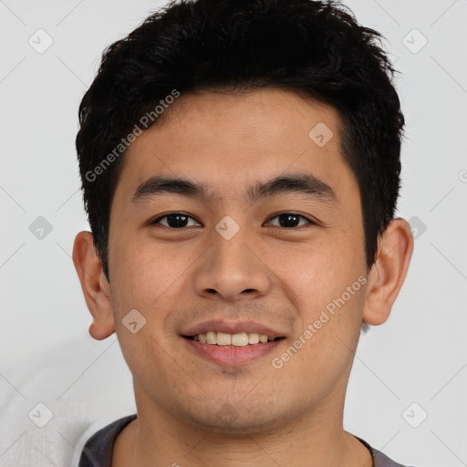 Joyful asian young-adult male with short  black hair and brown eyes