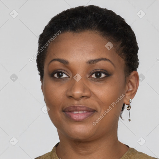 Joyful black young-adult female with short  brown hair and brown eyes