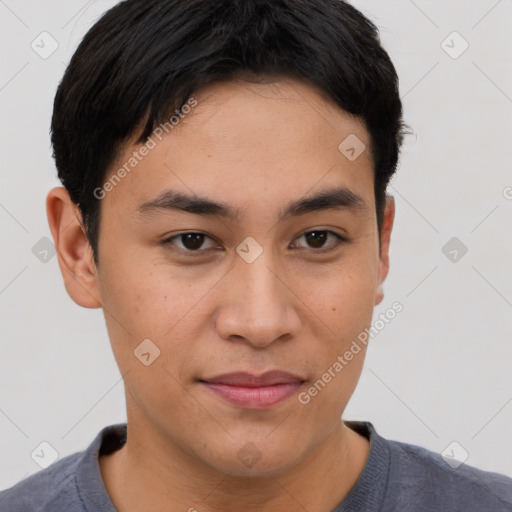 Joyful asian young-adult male with short  brown hair and brown eyes