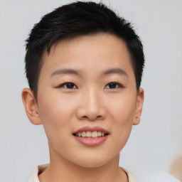 Joyful asian young-adult female with short  brown hair and brown eyes