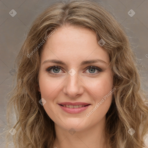 Joyful white young-adult female with long  brown hair and green eyes