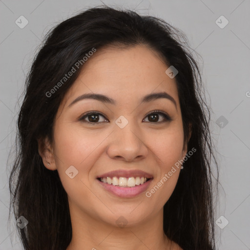 Joyful latino young-adult female with long  brown hair and brown eyes