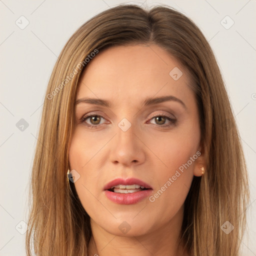 Joyful white young-adult female with long  brown hair and brown eyes