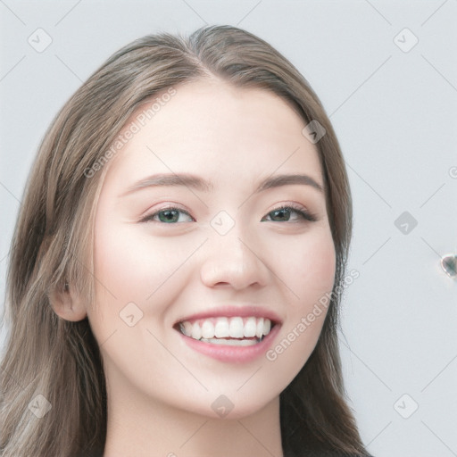 Joyful white young-adult female with long  brown hair and blue eyes