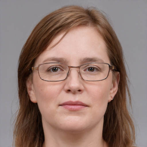 Joyful white adult female with medium  brown hair and grey eyes