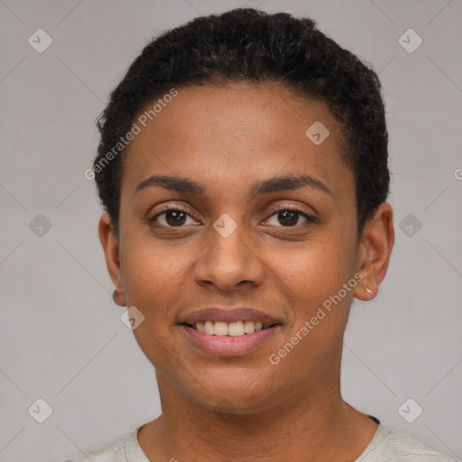 Joyful black young-adult female with short  brown hair and brown eyes