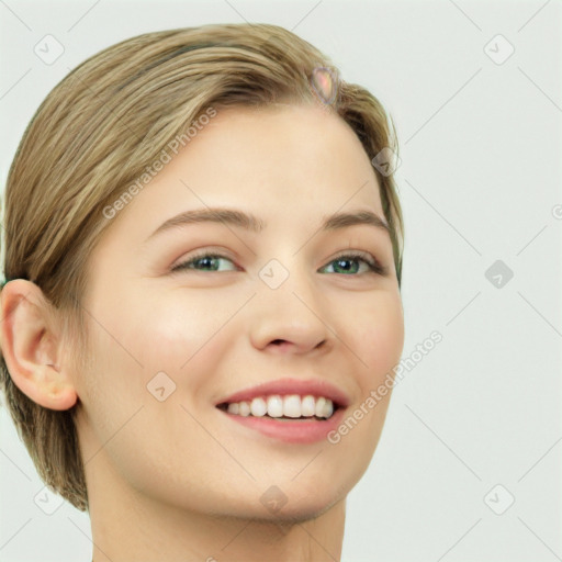 Joyful white young-adult female with long  brown hair and green eyes