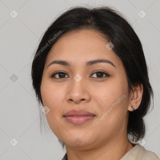 Joyful latino young-adult female with medium  brown hair and brown eyes