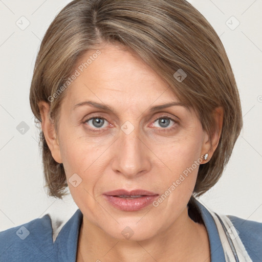 Joyful white adult female with medium  brown hair and grey eyes