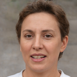 Joyful white adult female with short  brown hair and brown eyes