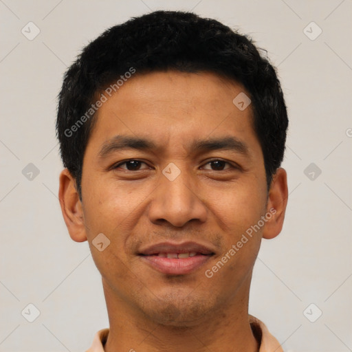 Joyful asian young-adult male with short  black hair and brown eyes