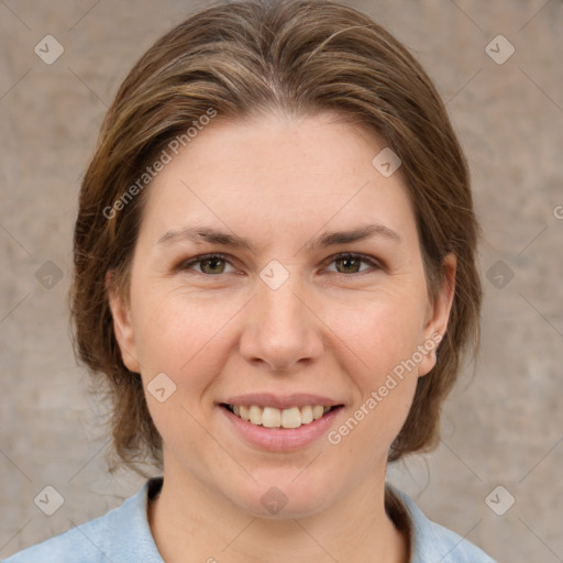 Joyful white adult female with medium  brown hair and grey eyes