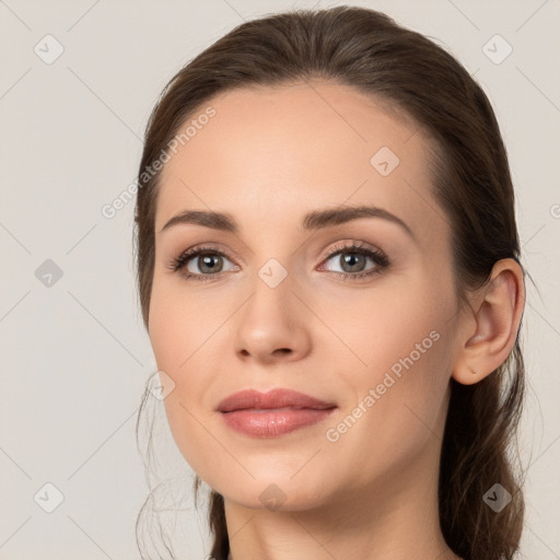 Neutral white young-adult female with long  brown hair and brown eyes