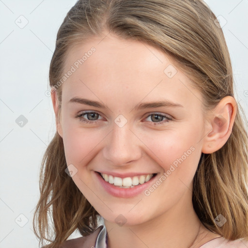 Joyful white young-adult female with long  brown hair and grey eyes