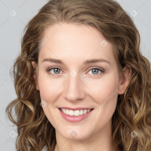 Joyful white young-adult female with long  brown hair and green eyes