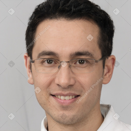 Joyful white adult male with short  brown hair and brown eyes