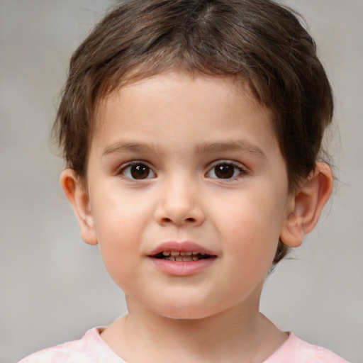 Joyful white child male with short  brown hair and brown eyes