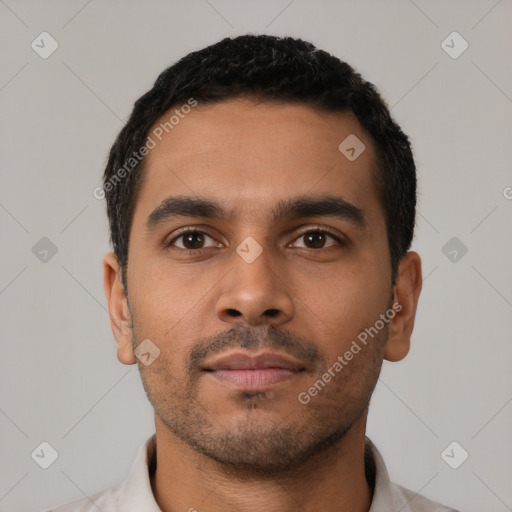 Neutral latino young-adult male with short  black hair and brown eyes
