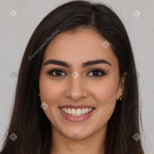 Joyful latino young-adult female with long  brown hair and brown eyes