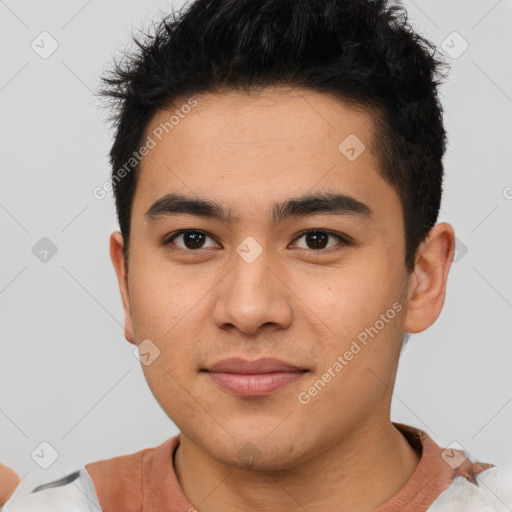 Joyful latino young-adult male with short  brown hair and brown eyes