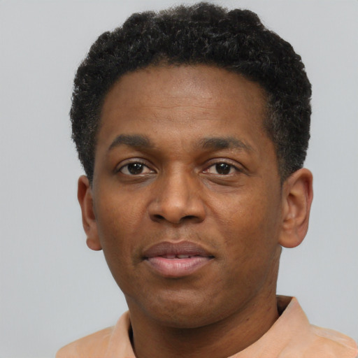 Neutral black young-adult male with short  black hair and brown eyes
