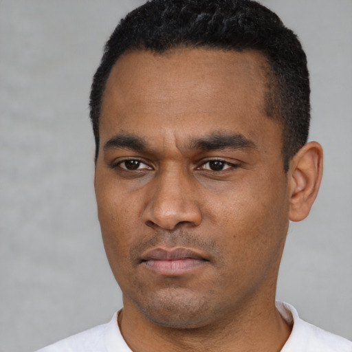 Neutral latino young-adult male with short  black hair and brown eyes