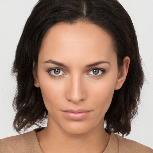 Neutral white young-adult female with medium  brown hair and brown eyes