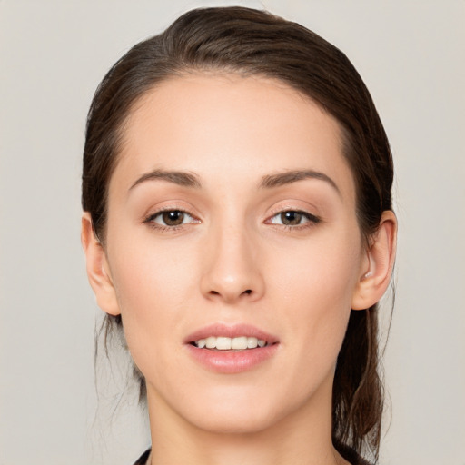 Joyful white young-adult female with medium  brown hair and brown eyes