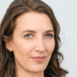 Joyful white adult female with long  brown hair and brown eyes