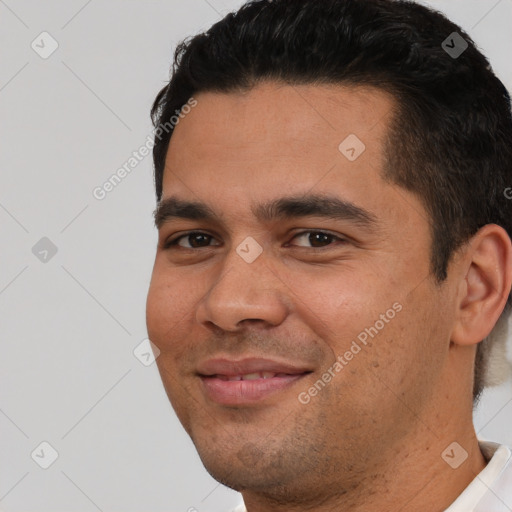 Joyful white young-adult male with short  black hair and brown eyes