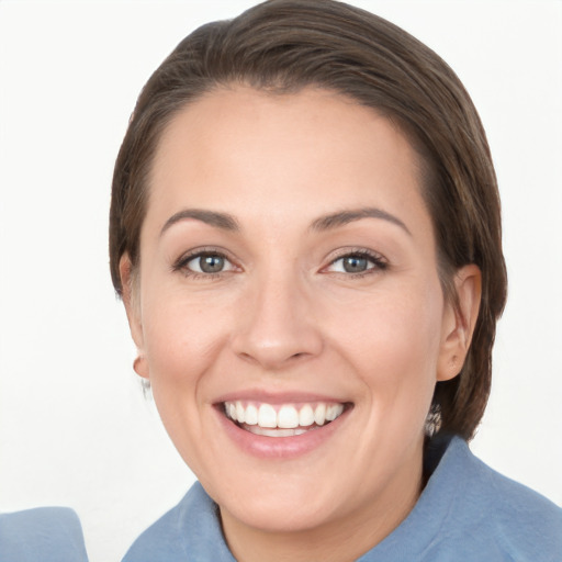 Joyful white young-adult female with short  brown hair and grey eyes